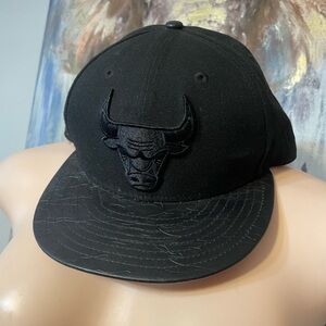 Chicago Bulls black snapback hat with a patent leather visor 9fifty adjustable
